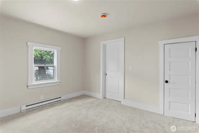 Primary bedroom with walk in closet