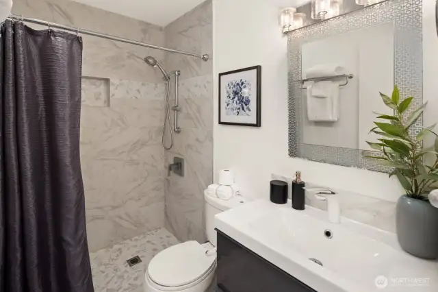 Primary remodeled bath for easy step in shower.