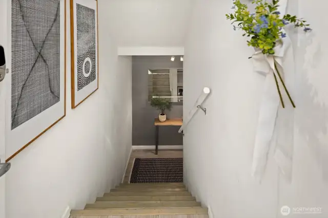 Private stairwell entry is part of the unit and provides a major storage room hidden underneath that is easily accessible.