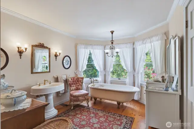 Primary bathroom with authentic claw foot tub and shower