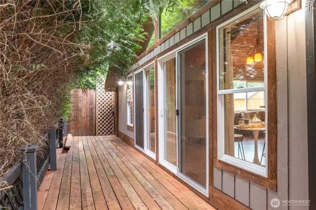 Wall of windows looking out to the trees, makes it feel like a treehouse