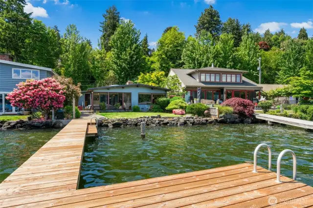 Charming mid-century modern home with 50 feet of prime waterfrontage on sought-after Rivieria Place!