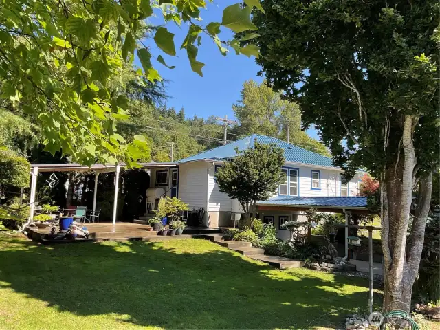 Rear corner view  of property from huge Alpine style storage building