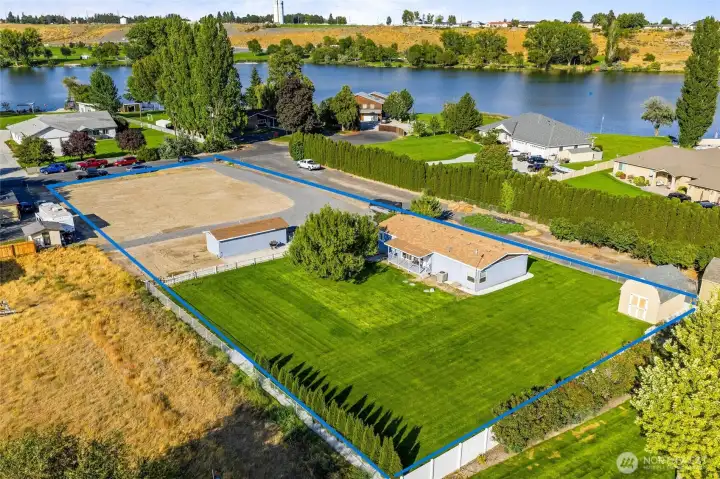 (property line is estimated). This serene location is easy to call home. Beautifully manicured backyard, parking for all your toys, and convenient access to the lake makes this property a true gem.