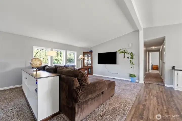 Large, spacious living room with comfortable seating and natural light.