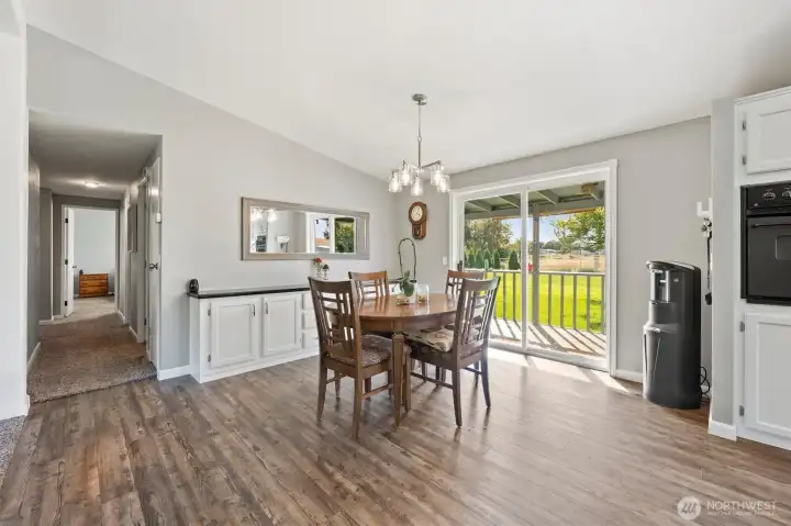 Enjoy all the natural light and view of your beautifully manicured backyard from this spacious eating area with a built-in buffet. The open design makes it perfect for both everyday meals and entertaining guests.