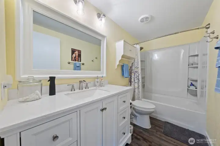This main bathroom features stylish, modern updates creating a refreshing and contemporary space.