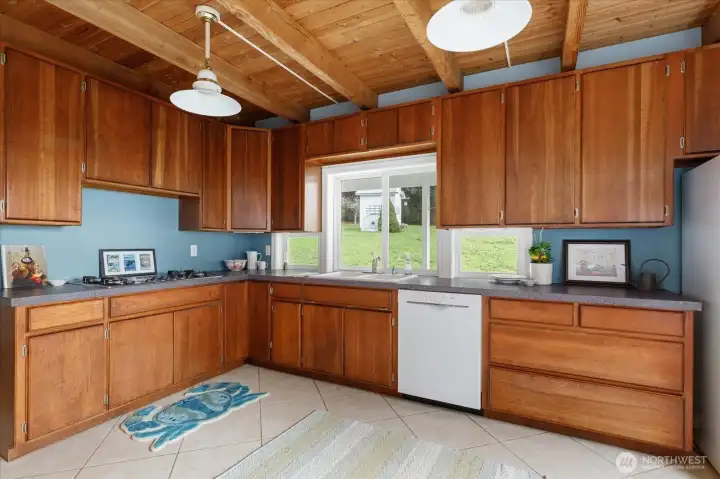 Kitchen has gorgeous solid cherry cabinets and ceramic double sink, newer appliances.