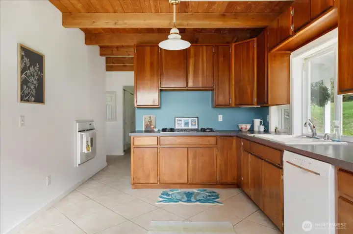 Kitchen showing creative placement of oven on the left.