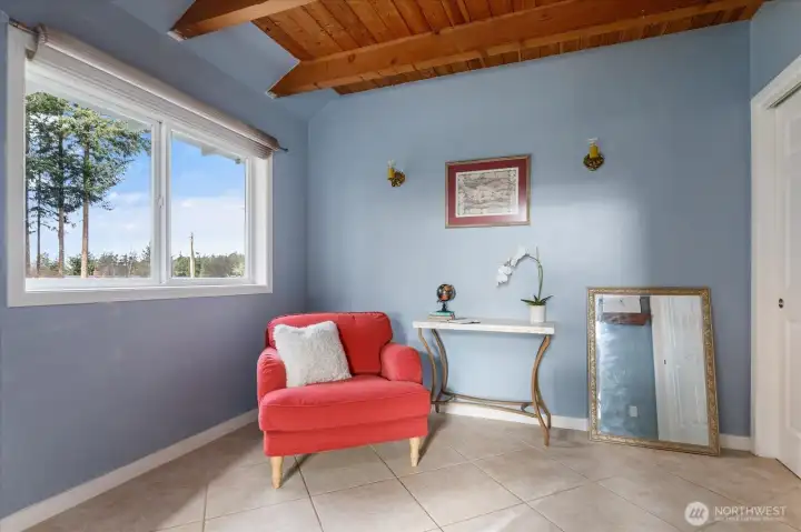 Office/den/bonus room with closet and french doors is adjacent to the living room.