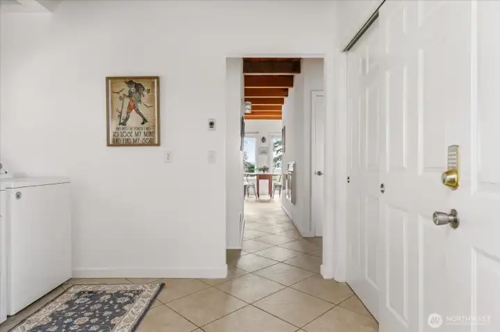 Laundry room/entry hallway leads you directly into the kitchen/dining area.
