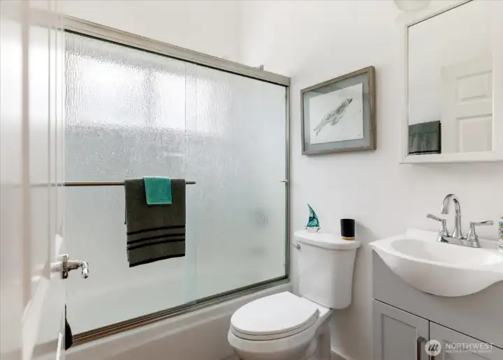 Upstairs shared bath is between the primary and second bedroom w/ tub and shower.