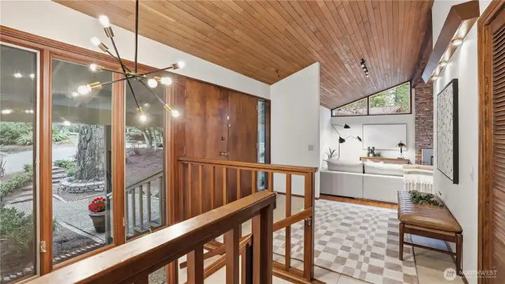 Entryway showcasing clean lines w/timber floor & ceiling evokes warmth and openness.