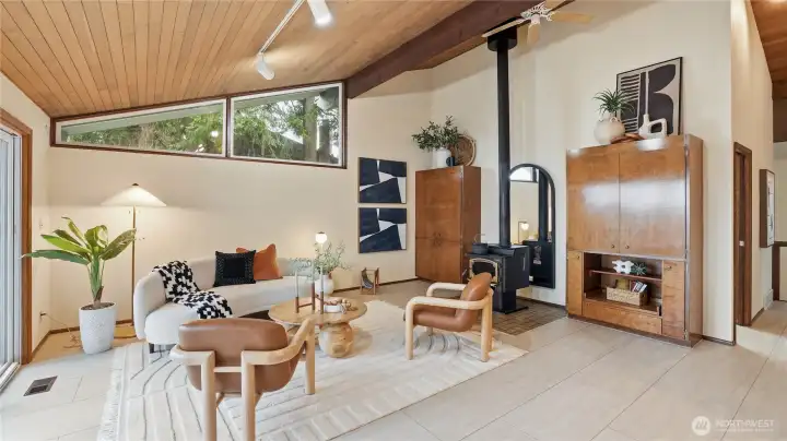 Custom built wood cabinets on both sides of the fireplace. Innermost cabinet is a wet bar.