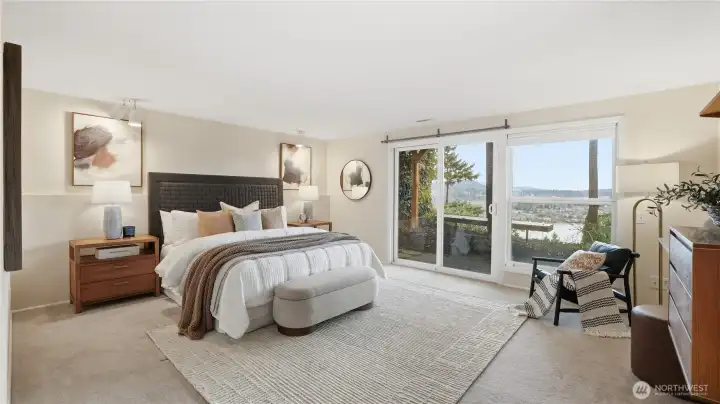 Primary Bedroom with access to patio for morning exercise or serene afternoon sips overlooking Lake Washington.