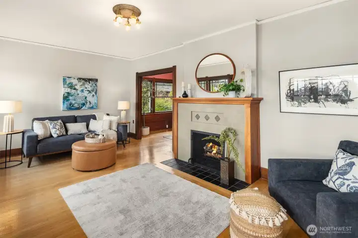 Elegant living room with inviting fireplace and entry to the beautiful formal dining room