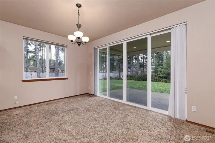 Dining area, with slider to the large backyard.