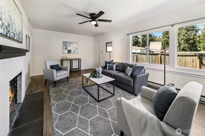Cozy fireplace and ceiling fan