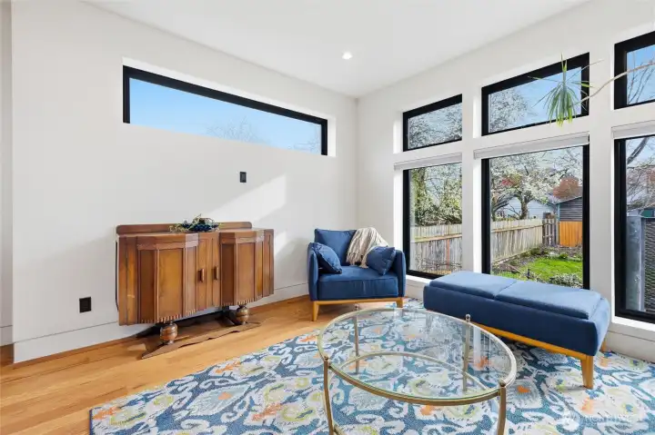 Living room with elevated windows to allow light in and maintain privacy.