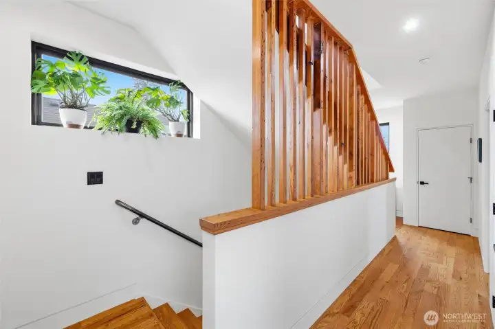 Stair railings made from salvaged wood from the original home built on the site.