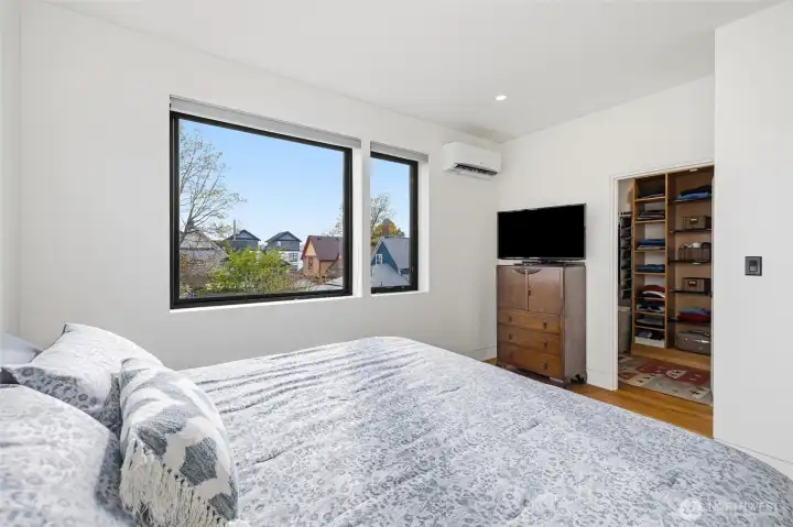 Primary bedroom with large windows and black-out blinds.  Separate heat pump to keep the temperature exactly how you like it.