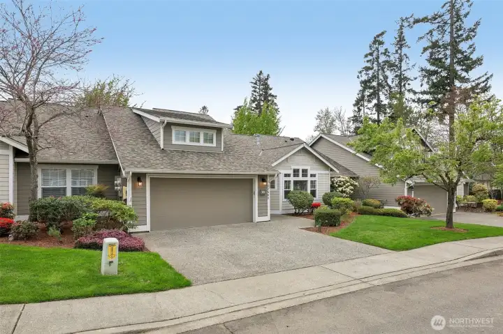 Large driveway, sidewalks, street lights, gorgeous landscaping enhance this homes appeal