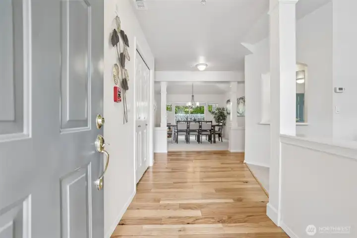 Foyer has engineered hardwoods, stunning view of dining room as you enter the home.