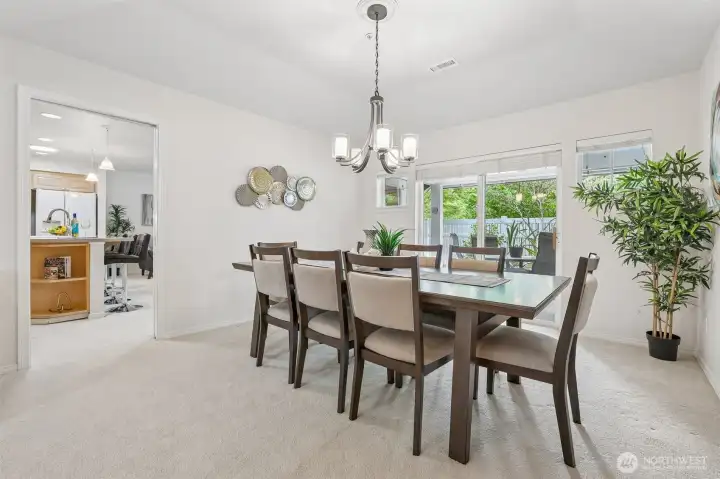 Dining Room with slider to covered patio - extend the gathering by opening up the spaces.