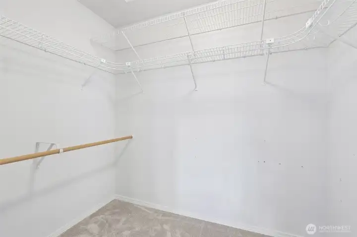 Primary bedroom walk in closet