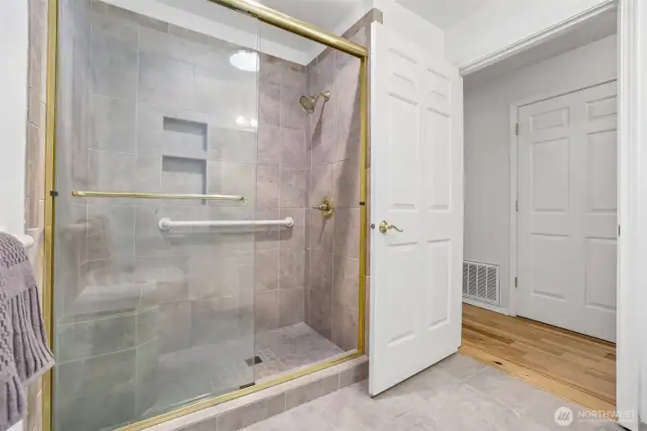 Hall Bathroom with tiles step in shower