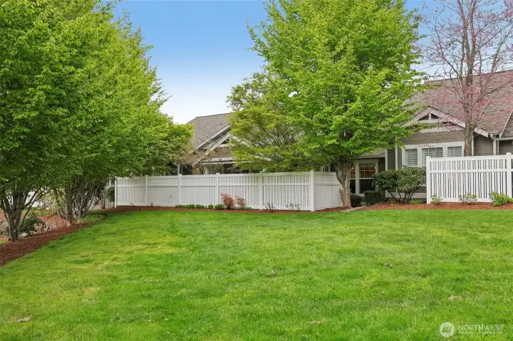 Grass area behind the condo home