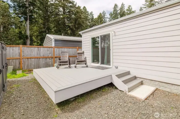 Get some plants, flowers a rug and your oasis is here