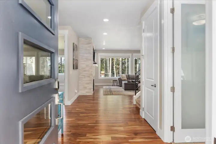 Bright entry with engineered hardwoods and a direct view into the main living area.