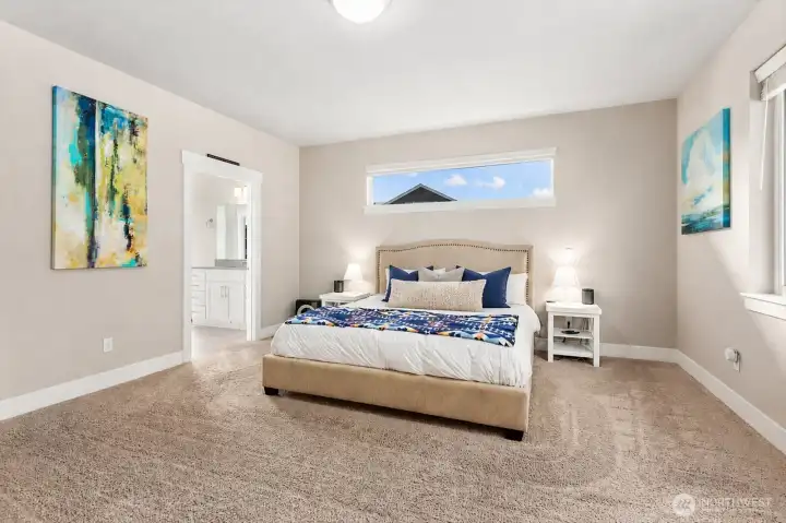 Spacious owner’s suite with a light-filled, open feel and seamless connection to the ensuite bath.