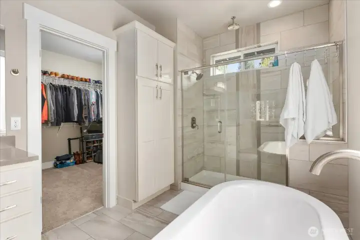 Thoughtful layout connecting the bath to a generous walk-in closet for added convenience.
