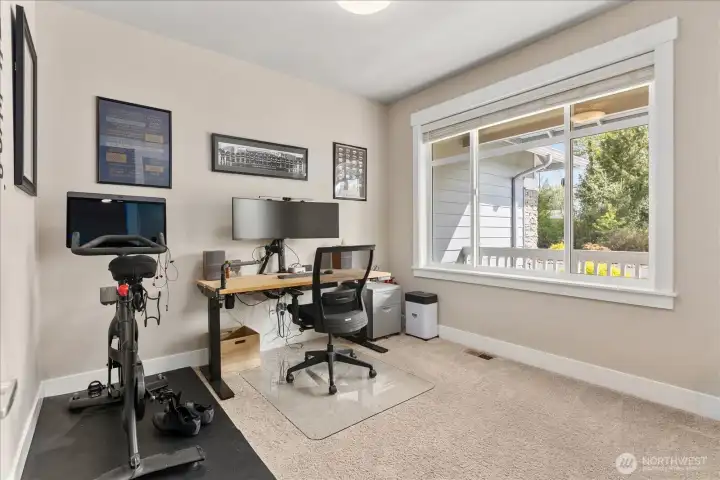 Main-level office or den with natural light—perfect for working from home or a quiet retreat.