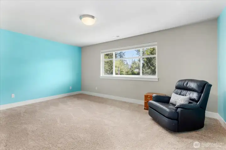 Bright secondary bedroom with a pop of color and great natural light.