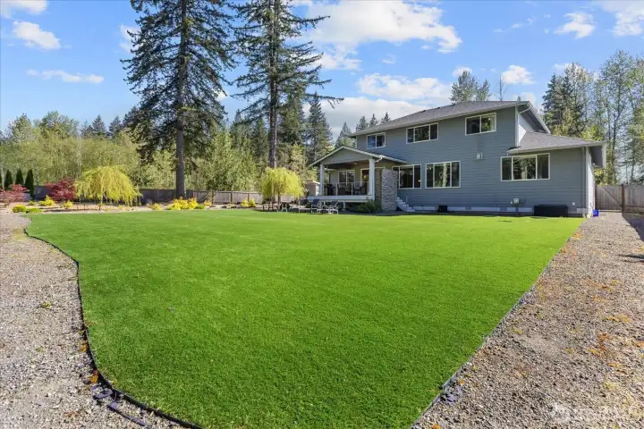 Thoughtfully designed outdoor space with open lawn, lounging areas, and room to make it your own.