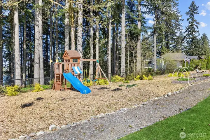 Play structure area with space to explore, unwind, and enjoy the natural surroundings.