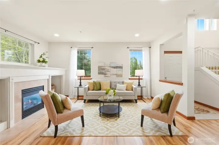Spacious living area highlighting the gas fireplace and natural light.