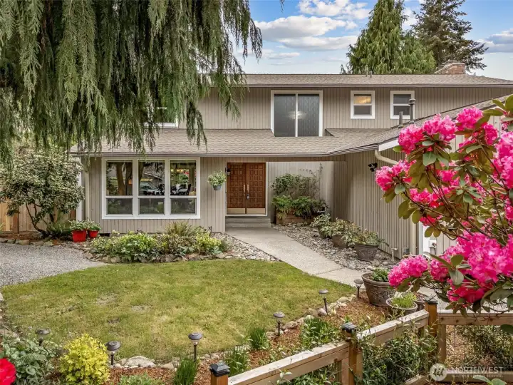 Overflowing with warmth, character, and thoughtful updates, this welcoming custom home on Scenic Hill is a real treat!