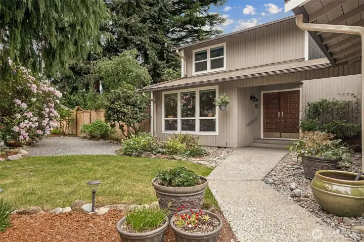 To the side of the house, there is a gate for easy access to the backyard garden shed!