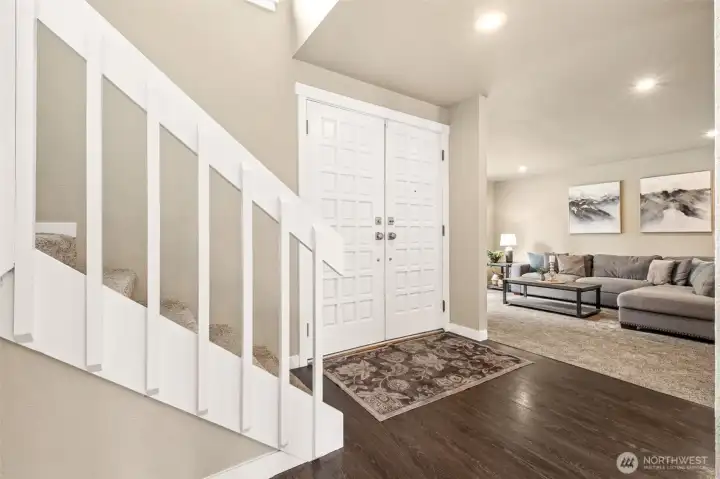 Welcome inside! The spacious foyer greets you, along with the luxury vinyl plank flooring, neutral colors, and bright lighting.