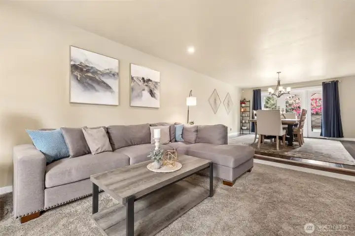 The large dining room flows easily into the living room, around the corner into the kitchen, and directly outside to the outdoor entertainment!