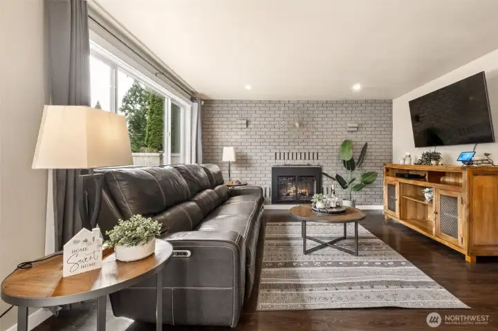 Bright windows, soothing colors, cozy fireplace - no room has been left untouched by these owners!