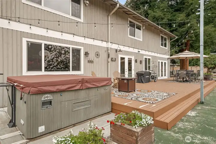 The private backyard is a real treat - from the expansive deck, to the included hot tub, and more!