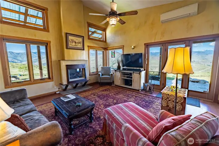 Great room with large windows to view mountain terrains. cork flooring with radiant heating