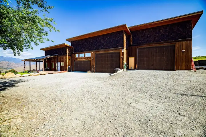 front showing home, car garages and barn