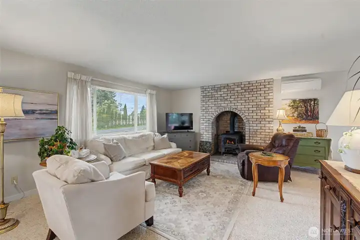 On the top floor you will experience a lovely open living room with a wood burning fireplace.