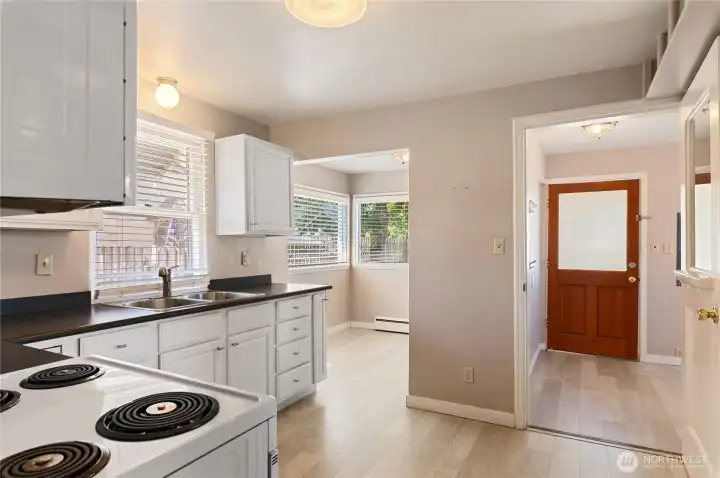 From kitchen doorway, room to left is additional eating area. Doorway on right is laundry/mud room access and back door. From kitchen doorway, room to left is additional eating area. Doorway on right is laundry/mud room access and back door.